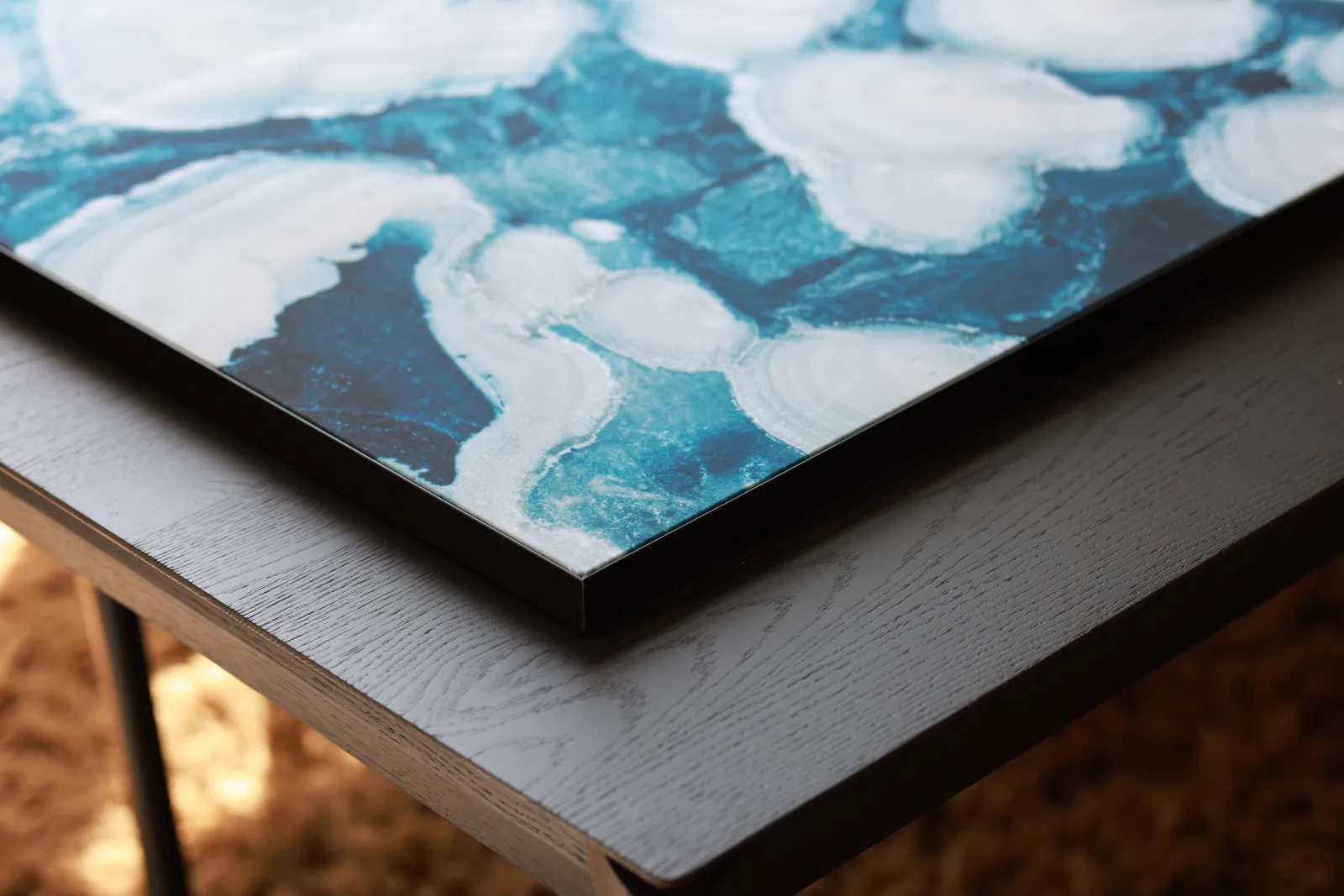 Close-up of a textile print in an aluminium frame