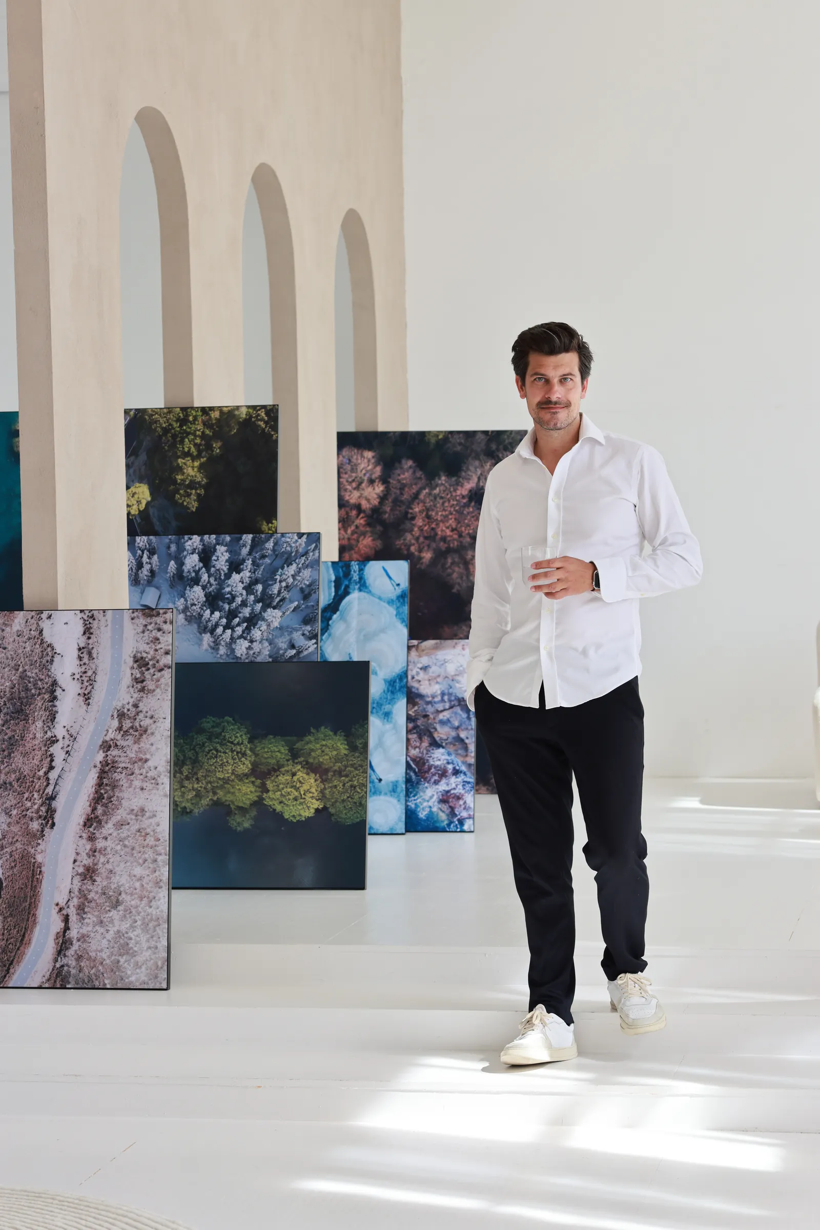Stefan van Gils, the DRONEMASTER, among his drone prints